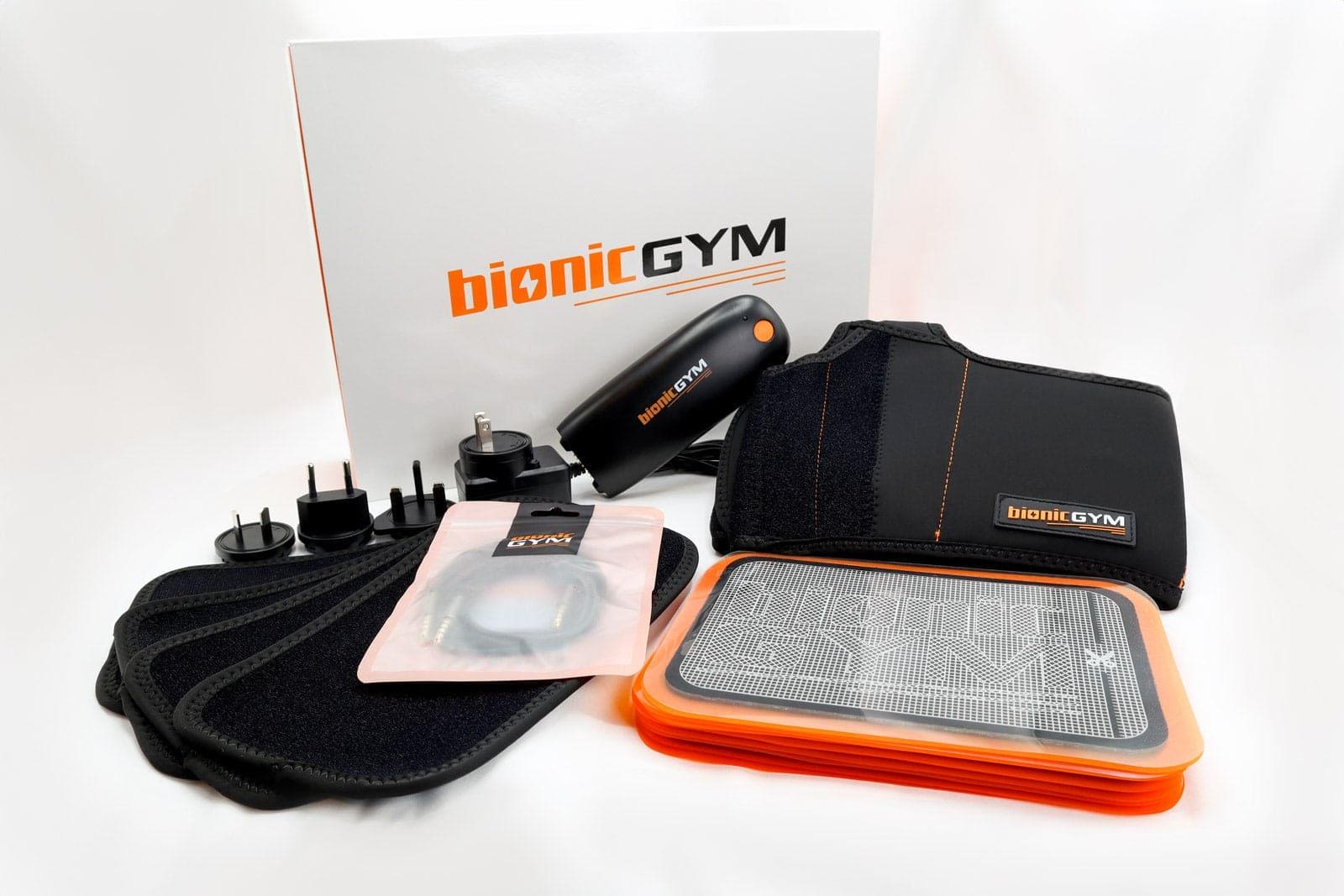 Exercise On Autopilot With BionicGym - BionicGym everything that's included in the box. Gel pads, wraps and extensions, aux cable, international charger, control unit